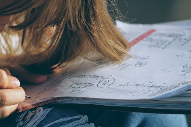 woman doing paper calculations